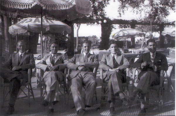 This picture shows Lieutenant Alan Hill, Lieutenant Lord John North and Chaplain Tom Harris in South Africa in May 1940. All died in Neptune. On far left is Sub Lieutenant E. Barrett and on far right is Lieutenant Tony Thackara both of whom survived. It is likely to have been the stag party before John North's wedding, with the Padre on hand to keep matters under control.\n\n
