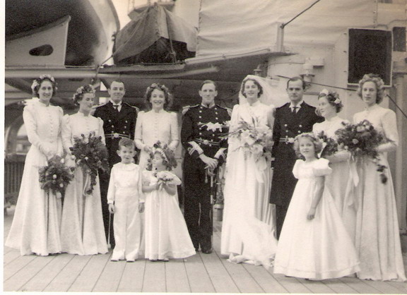 Wedding of Lieutenant Hon David Hotham to Aileen Coateson board Neptune in 1939 - bridal group\n\nFrom left to right:  ?, Helen Thackara, Lieutenant Patrick Coates, ?,  David Hotham, Aileen Coates, Lieutenant Pechell Parker, ?, ?\n\nDavid Hotham and Pechell Parker survived the sinking but Pat Coates died in HMS Ark Royal on 26 November 1940.\n