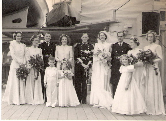 Wedding of Lieutenant Hon David Hotham to Aileen Coateson board Neptune in 1939 - bridal group\n\nFrom left to right: ?, Helen Thackara, Lieutenant Patrick Coates, ?, David Hotham, Aileen Coates, Lieutenant Pechell Parker, ?, ?\n\nDavid Hotham and Pechell Parker survived the sinking but Pat Coates died in HMS Ark Royal on 26 November 1940.\n Wedding of Lieutenant Hon David Hotham to Aileen Coateson board Neptune in 1939 - bridal group\n\nFrom left to right: ?, Helen Thackara, Lieutenant Patrick Coates, ?, David Hotham, Aileen Coates, Lieutenant Pechell Parker, ?, ?\n\nDavid Hotham and Pechell Parker survived the sinking but Pat Coates died in HMS Ark Royal on 26 November 1940.\n