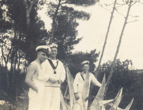 Leading Stoker Emmanuel Newton in centre with unknown Petty Officer Stoker on left and another unknown Stoker on right\n